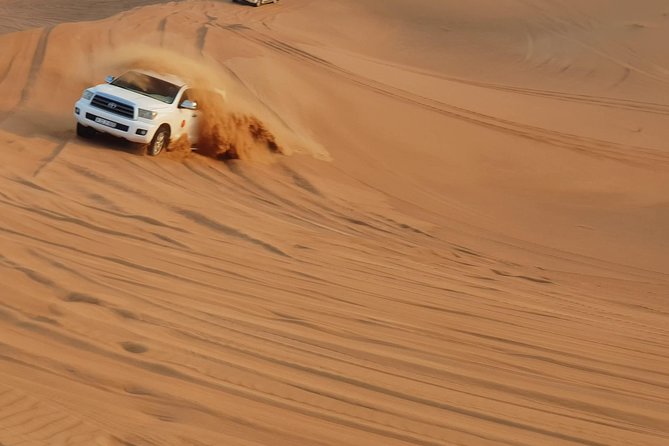 Dubai Desert Safari, Quad Bike, Camel Ride, and Buffet Dinner - Sunset views before the camp visit