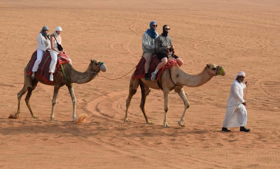 Dubai: Desert Safari, Quad Bike, Camel Ride and Sandboarding - Optional quad biking for extra speed