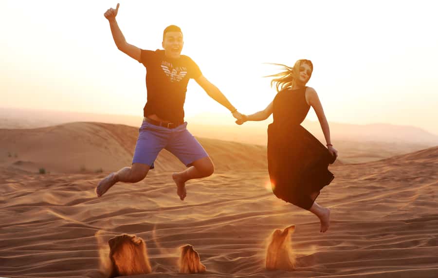 Dubai: Desert Safari, Quad Bike, Sandboarding, Camels & BBQ - Sandboarding on the red dunes