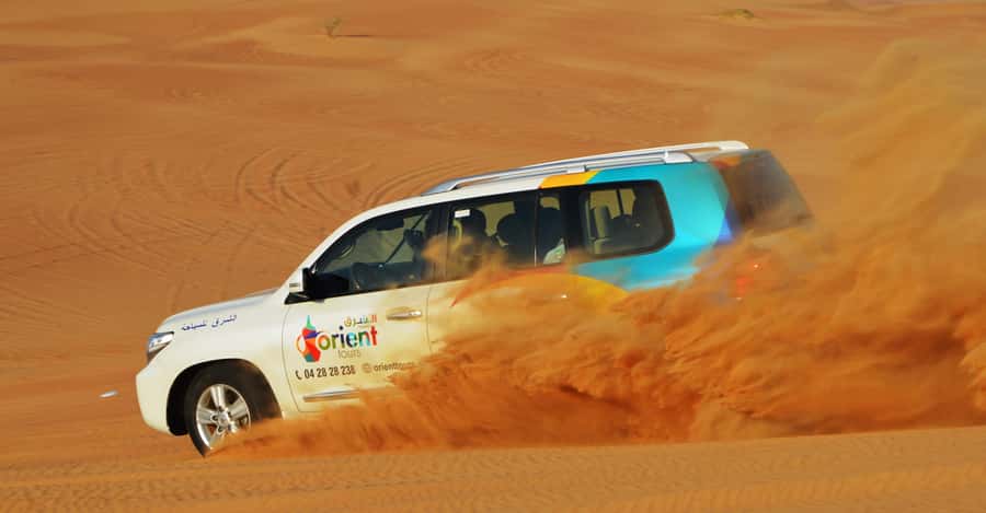 Dubai Desert Safari, Quad Biking, Camel Ride, & Sandboarding - Lahbab photo stop and sandboarding