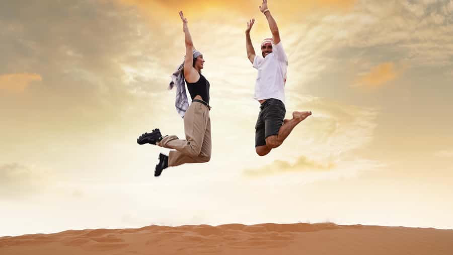 Dubai Desert Safari - Sandboarding, Quad Bike & BBQ Options - Sunset, sandboarding, and a short camel ride
