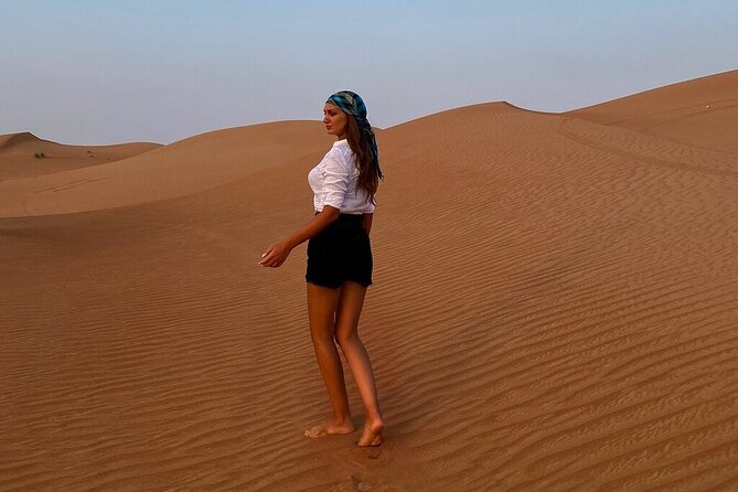 Dubai Desert Safari: Tanoura Show, Dune Bashing and BBQ Dinner - Sandboarding adds a simple burst of fun