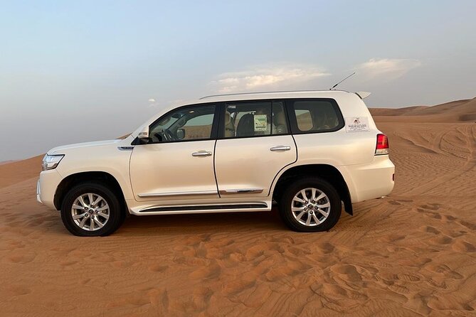 Dubai Desert Safari Thrilling Adventure Unforgettable Experiences - Sunset photos and the evening entertainment