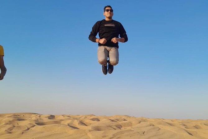 Dubai Desert Safari Thrilling Adventure Unforgettable Experiences - Camel riding, sandboarding, and henna at camp