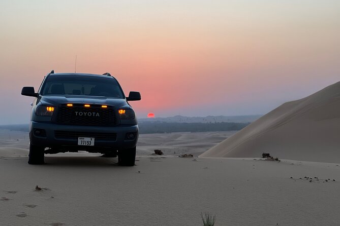 Dubai desert safari with 4x4 Dune Bashing,Camel Ride sand board - Sunset photos before the evening camp program