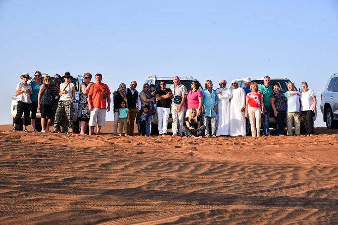 Dubai Desert Safari with BBQ and 4WD Land Cruiser Dune Bashing - Belly dancing, Tanoura, music, and fire