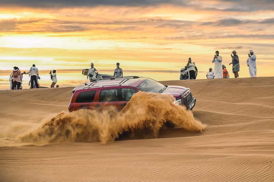 Dubai: Desert Safari with BBQ Dinner & Quad Biking Options - Sandboarding and a short camel ride