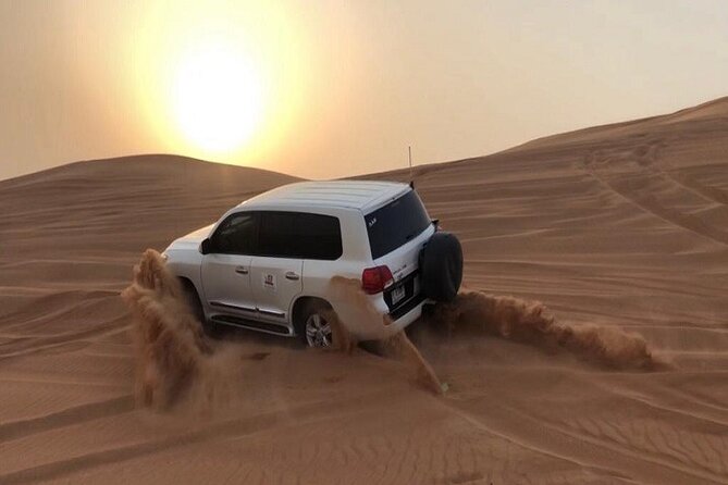Dubai Desert Safari With Camel Ride and Sand Boarding - The first rush over the dunes