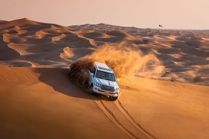 Dubai Desert Safari with Camel Ride, Sand surf, & BBQ Dinner - Red Dunes, Dune Driving, and the Sandboarding Stop