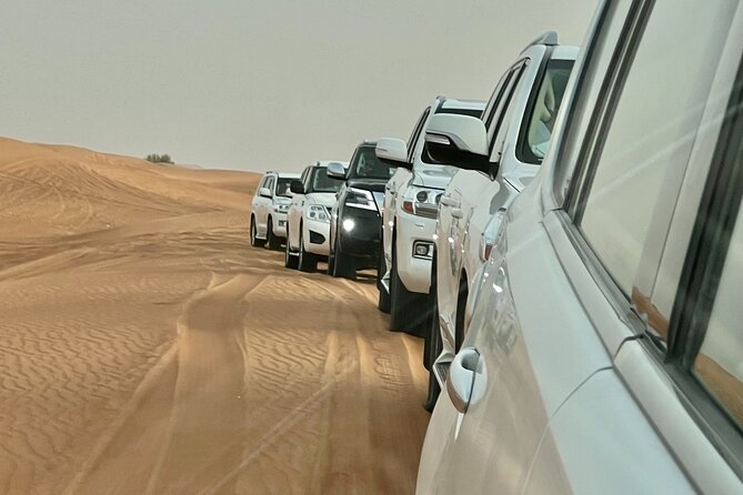 Dubai Desert Safari with Camel Ride, Sand surf, & BBQ Dinner - Arriving at the Bedouin-Style Camp