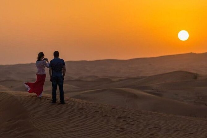 Dubai Desert Safari With Dinner And Live Shows - Sunset views, sandboarding, and a short camel ride