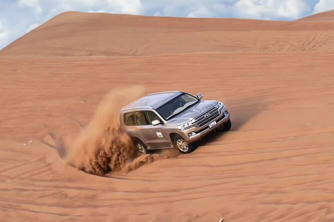Dubai Desert Safari with Dune Bashing & Live Shows - Sandboarding without an extra charge