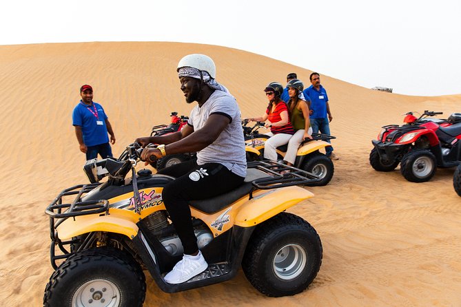 Dubai Desert Safari with Quads, BBQ Dinner, Camel ride, & Shows - Camel riding and sand art slow the pace