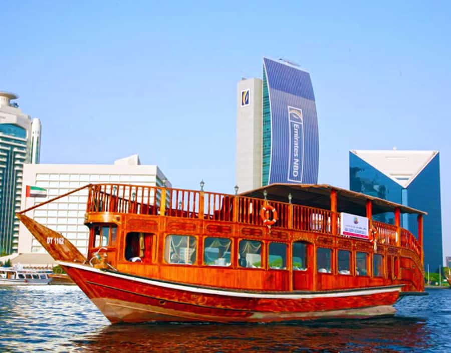 Dubai: Dhow Dinner Cruise on Creek or Marina with Live Shows - Sunset views and Dubai after dark