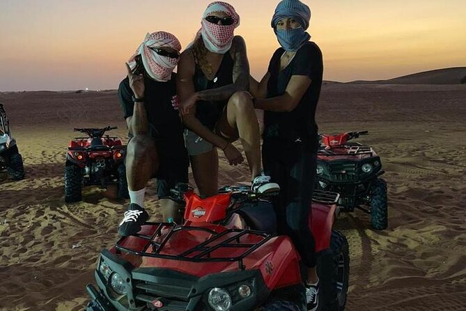 Dubai Dinner Desert Experience with 01 Hour quad bike and camel ride - Sunset leads into an Arabian-style camp evening