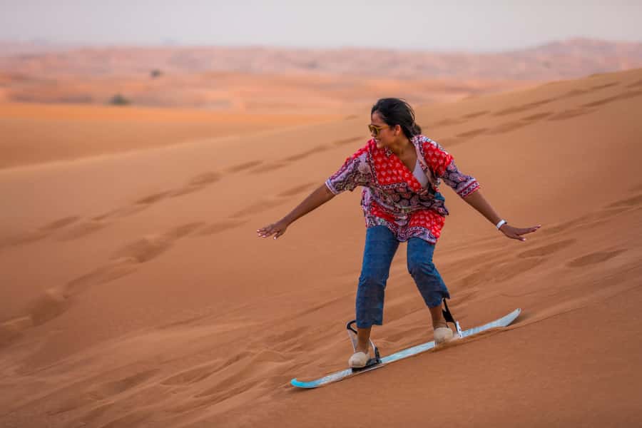Dubai: Dune Buggy Desert Safari, Camel Ride & Sandboarding - Sandboarding on the dune slopes