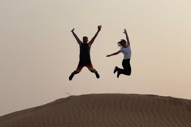 Dubai Elite Red Dunes Safari With Sunset & Bedouin Camp - ATV riding across the desert sand