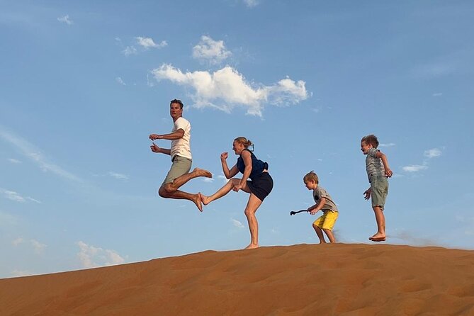Dubai Elite Red Dunes Safari With Sunset & Bedouin Camp - Sandboarding and high-dune sunset photos