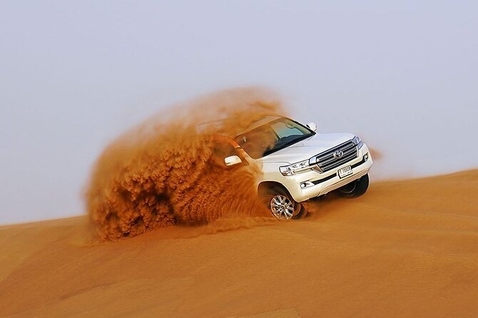 Dubai Evening Desert Safari & BBQ Dinner - Belly dance, tanura, and fire performances
