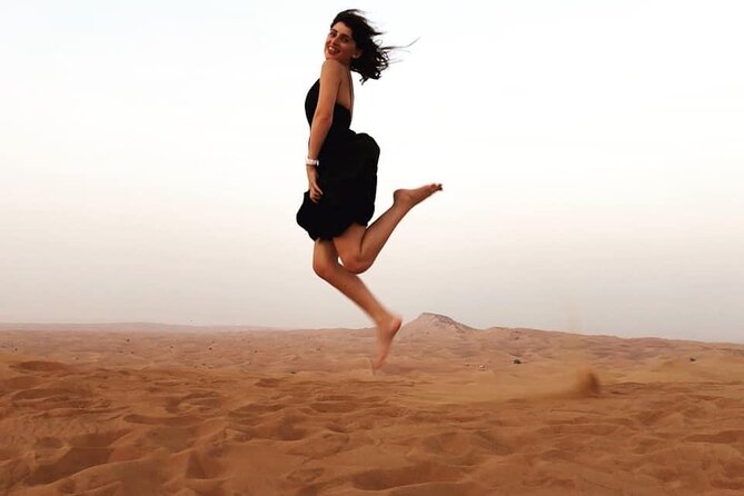 Dubai Evening Desert Safari with BBQ & Live Entertainment - Camel Ride, Arabic Coffee, Henna, and Falcon Photos