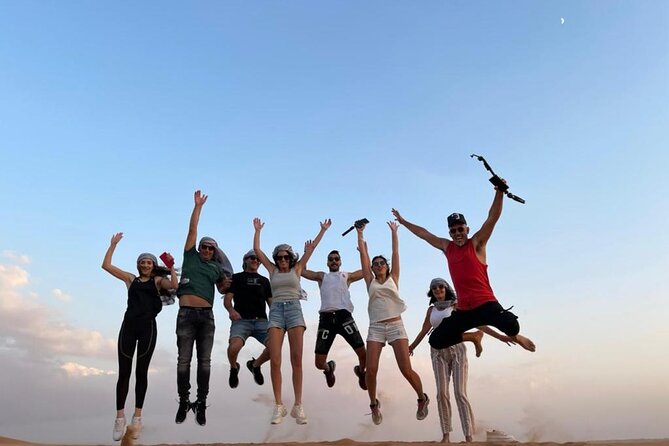 Dubai Evening Desert Safari With Transfers Dune Bashing & Dinner - Sandboarding and the sunset photo stop