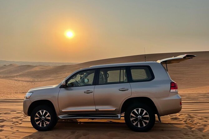 Dubai Evening Desert Safari With Transfers Dune Bashing & Dinner - Ninety minutes of music, dance, and fire