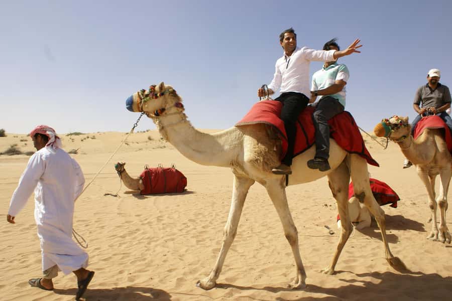 Dubai: Evening Tour with Quad Biking, Camel Ride, and BBQ - The camel ride is traditional, but very short