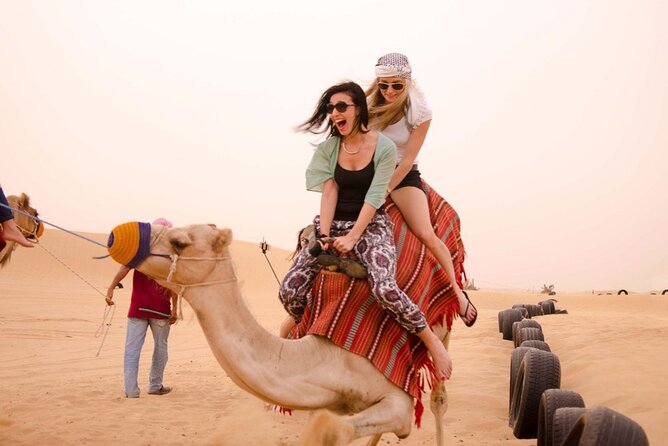 Dubai Evening4x4 Only Dune Drive Desert Safari Camel Ride - Sandboarding adds a second kind of fun