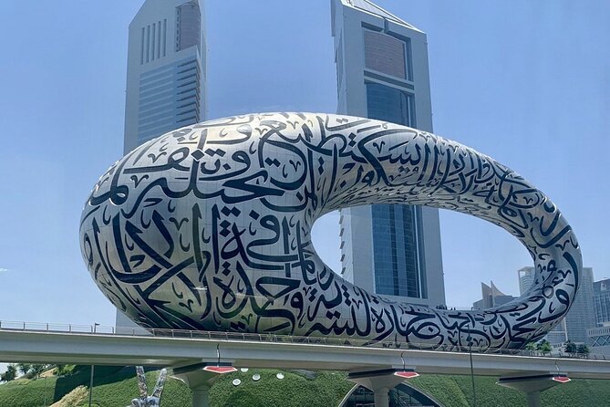 Dubai Half Day City Tour With Burj Khalifa Ticket - Jumeirah Beach and the familiar Dubai postcard