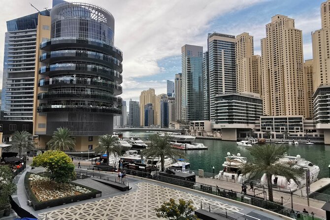 Dubai Half Day City Tour With Burj Khalifa Ticket - The abra across Dubai Creek and Old Souk