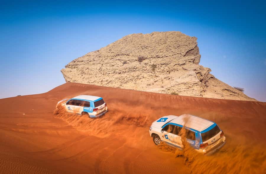 Dubai: Half-Day Desert Safari, Camel Ride, ATV & Dune Buggy - From Dubai streets to Lahbab’s red dunes