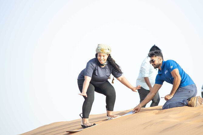 Dubai Half-day Red Dunes bashing with Sandboarding, Camel &Falcon - Sandboarding after the dune bashing