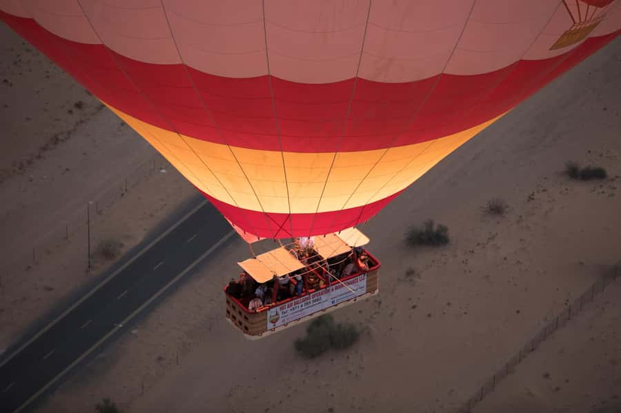 Dubai: Hot Air Balloon Ride with Camel Ride & Falcon Show - The early pickup and drive from Dubai