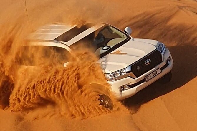 Dubai: Jeep Desert Safari, Camel Ride, and Quad Bike Tour - Sandboarding adds a simple, playful stop