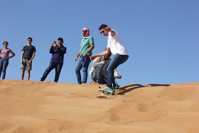 Dubai: Jeep Desert Safari, Camel Ride, and Quad Bike Tour - Al Aweer Camp, BBQ, and traditional entertainment