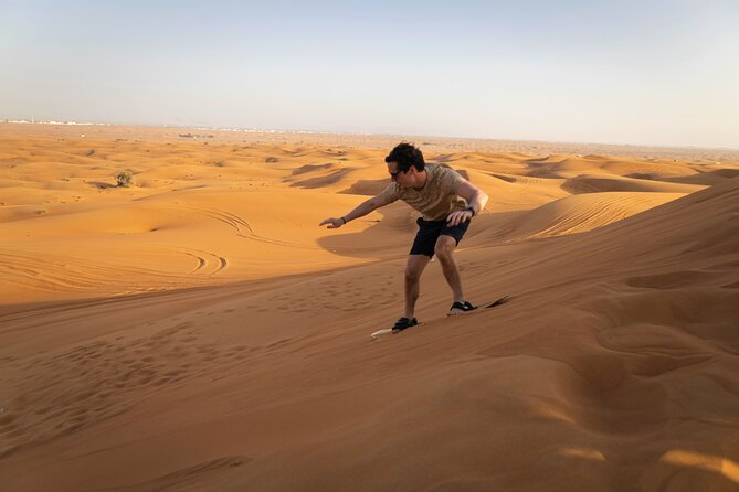 Dubai Long Self-Drive Quadbike with Camel and Falcon - Sandboarding adds a simple change of pace