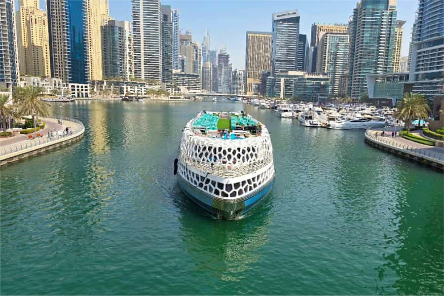 Dubai: Mega Yacht Dinner Cruise with Buffet - The opening route through Dubai Marina