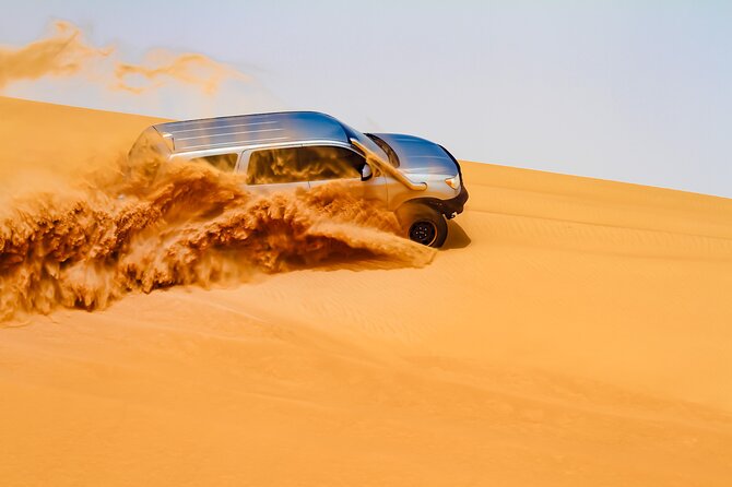 Dubai Morning Evening Desert Safari,Sand boarding and Camel ride - Sandboarding gives you an active desert stop