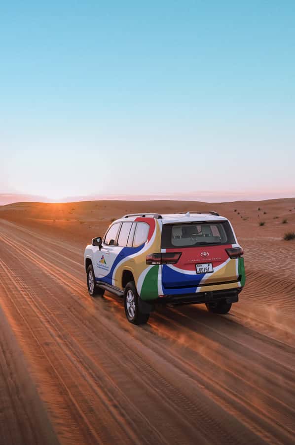 Dubai: Premium Desert Safari, Camel Ride, BBQ & Sandboarding - Sunset, soft drinks, and the best photo stop