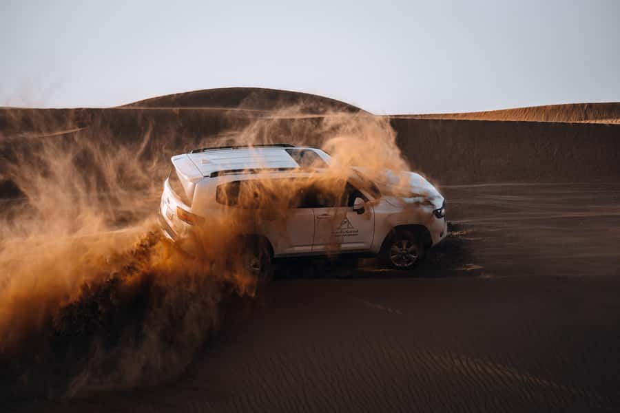 Dubai: Premium Desert Safari, Camel Ride, BBQ & Sandboarding - Dune bashing with a careful driver