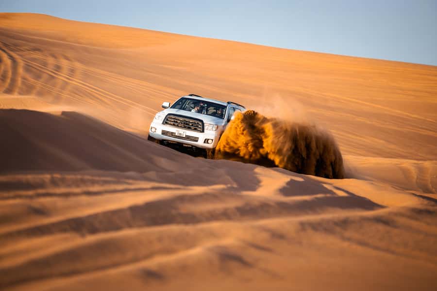 Dubai: Premium Red Dune Safari with Sandboarding & BBQ - Sandboarding on the red dunes