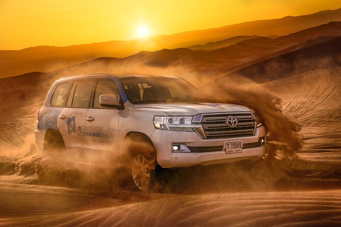Dubai Premium Red Dunes Safari, Camels & 5<em> BBQ at Al Khayma camp – Quick points to know’ /></p>
<ul>
<li><strong>Red Lahbab dunes:</strong> The safari heads to Dubai’s red-sand desert, about an hour from the city, for dune driving and sandboarding.</li>
<li><strong>A full activity package:</strong> You get dune bashing, sandboards, camel riding, camel feeding, falcon photos, henna, Arabic dress, shisha, dinner, entertainment, and drinks.</li>
<li><strong>Al Khayma Camp dinner:</strong> The buffet includes BBQ, vegetarian and non-vegetarian dishes, local sweets, dates, Arabic coffee, tea, water, and soft drinks.</li>
<li><strong>Evening extras:</strong> Sunset photos, Tanoura and Khaliji dancing, a fire show, and telescope stargazing are included with evening departures.</li>
<li><strong>ATVs cost extra:</strong> Quad biking is available only with selected options or on request, and you pay separately.</li>
<li><strong>Timing matters:</strong> Pickup can occur within 45 minutes before your selected departure time. The 11:30 AM option includes lunch, but not the nighttime fire show or stargazing.</li>
</ul>
<h2 id="why-the-lahbab-red-dunes-are-worth-the-drive">Why the Lahbab red dunes are worth the drive</h2>
<p><img width="669" height="446" decoding="async" src=