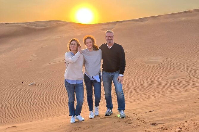 Dubai Private 4x4 Car Desert Safari with Dinner, Camel, and Show - Sandboarding and desert photographs