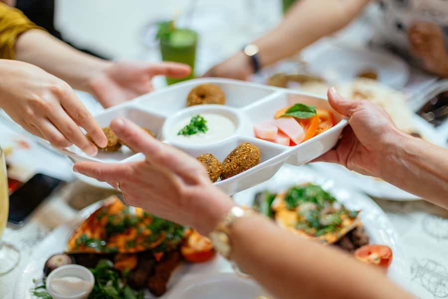 Dubai: Private Food Tour – 10 Tastings with Locals - Ten tastings, from dates to camel burger