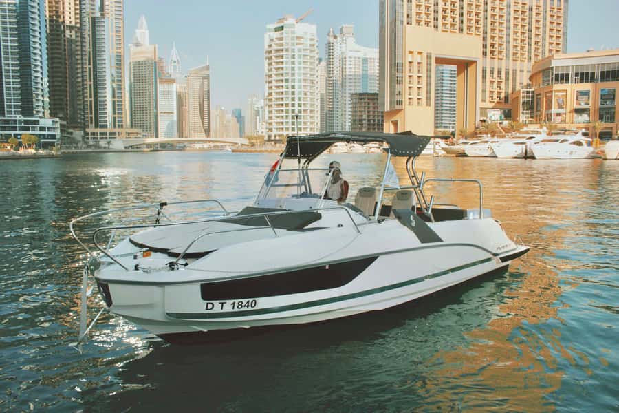 Dubai: Private Sea Escape Cruise - Swim, Tan & Sightsee - Leaving Dubai Marina and passing JBR