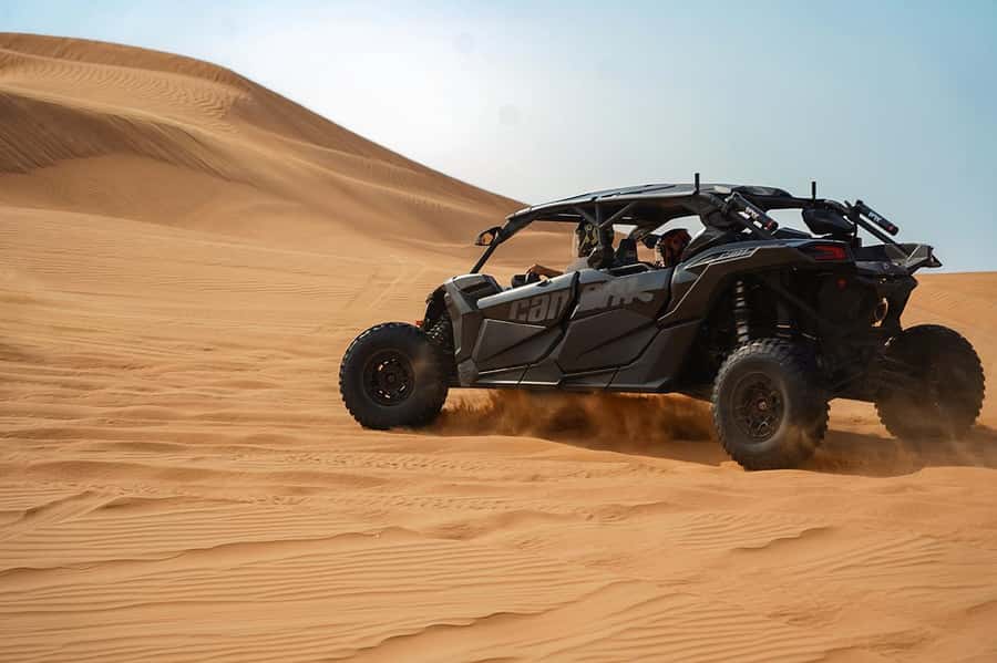 Dubai: Quad Bike, Dune Buggy, and Sandboarding Experience - Sandboarding down the red dunes