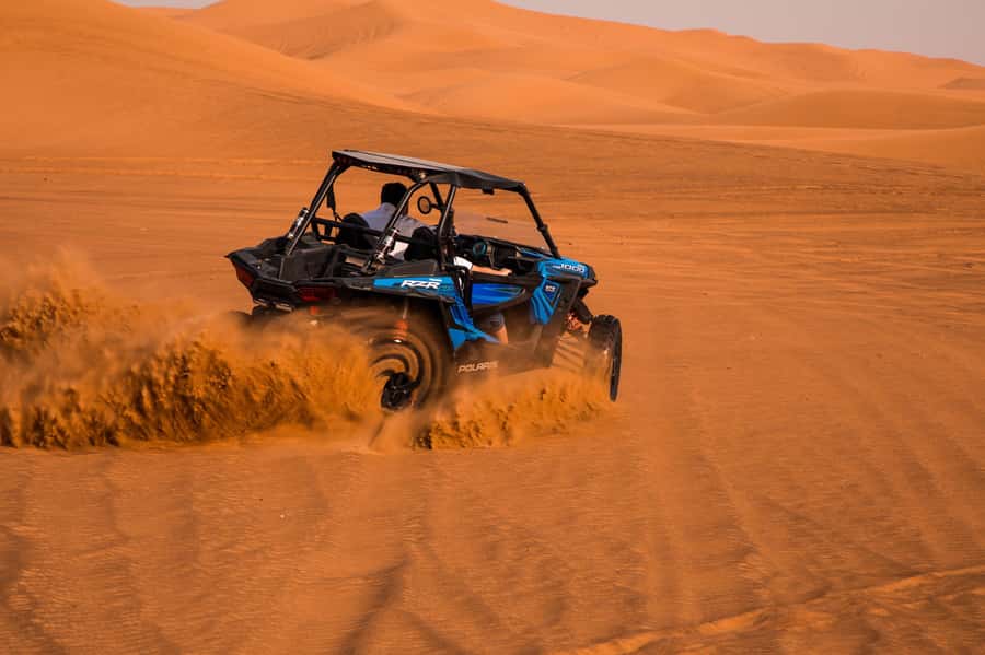 Dubai: Red Dune Desert Safari, Quad Bike, Camels, and BBQ - Sandboarding with a simple learning curve