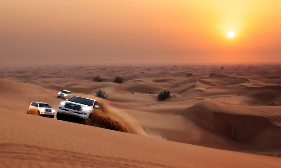 Dubai: Red Dune Desert Safari, Quad Bike, Camels, and BBQ - The camel ride and sunset pause