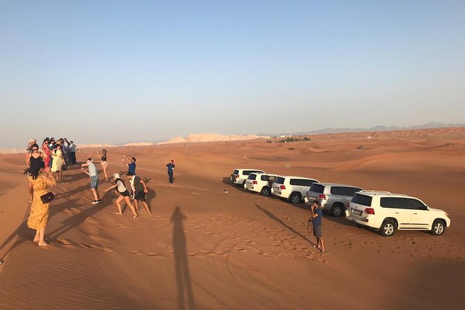 Dubai Red Dune Extreme Desert Safari Adventure With Sand Boarding - Sandboarding from a high dune