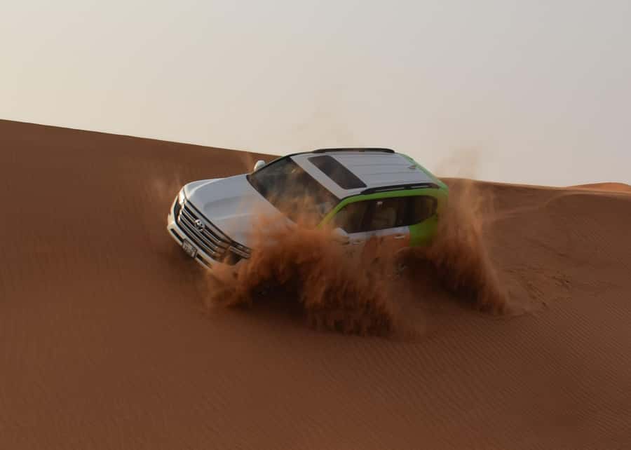 Dubai: Red Dune Safari, Quad Bike, Camel Ride, BBQ Dinner - Red dunes, dune bashing, and sandboarding